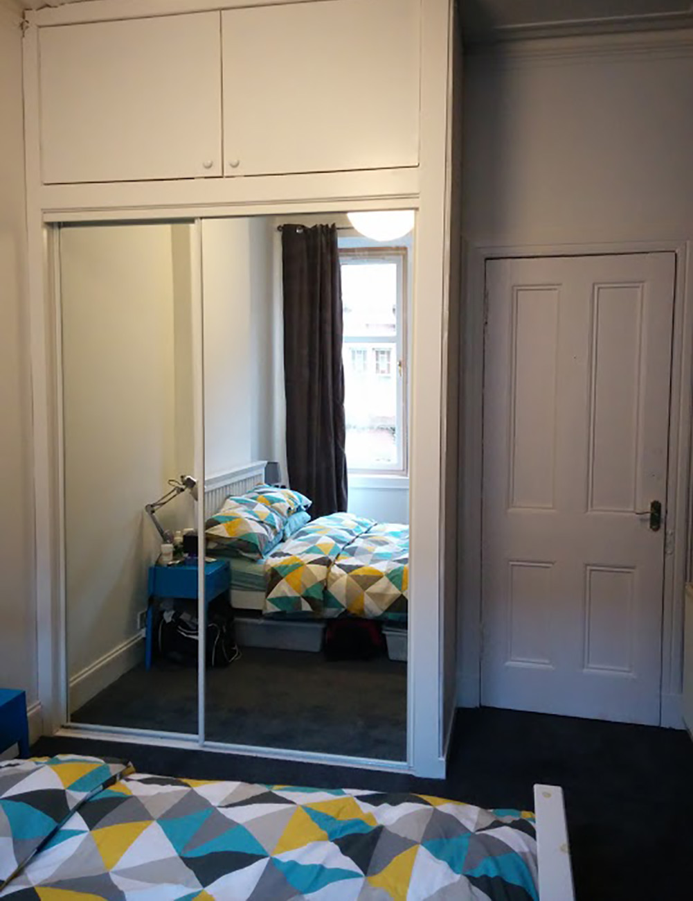 Built in wardrobe created behind door space